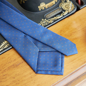 
                  
                    Patterned tie in pure blue and brown polka dot silk
                  
                