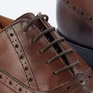 
                  
                    Oxford brogue in brown leather
                  
                